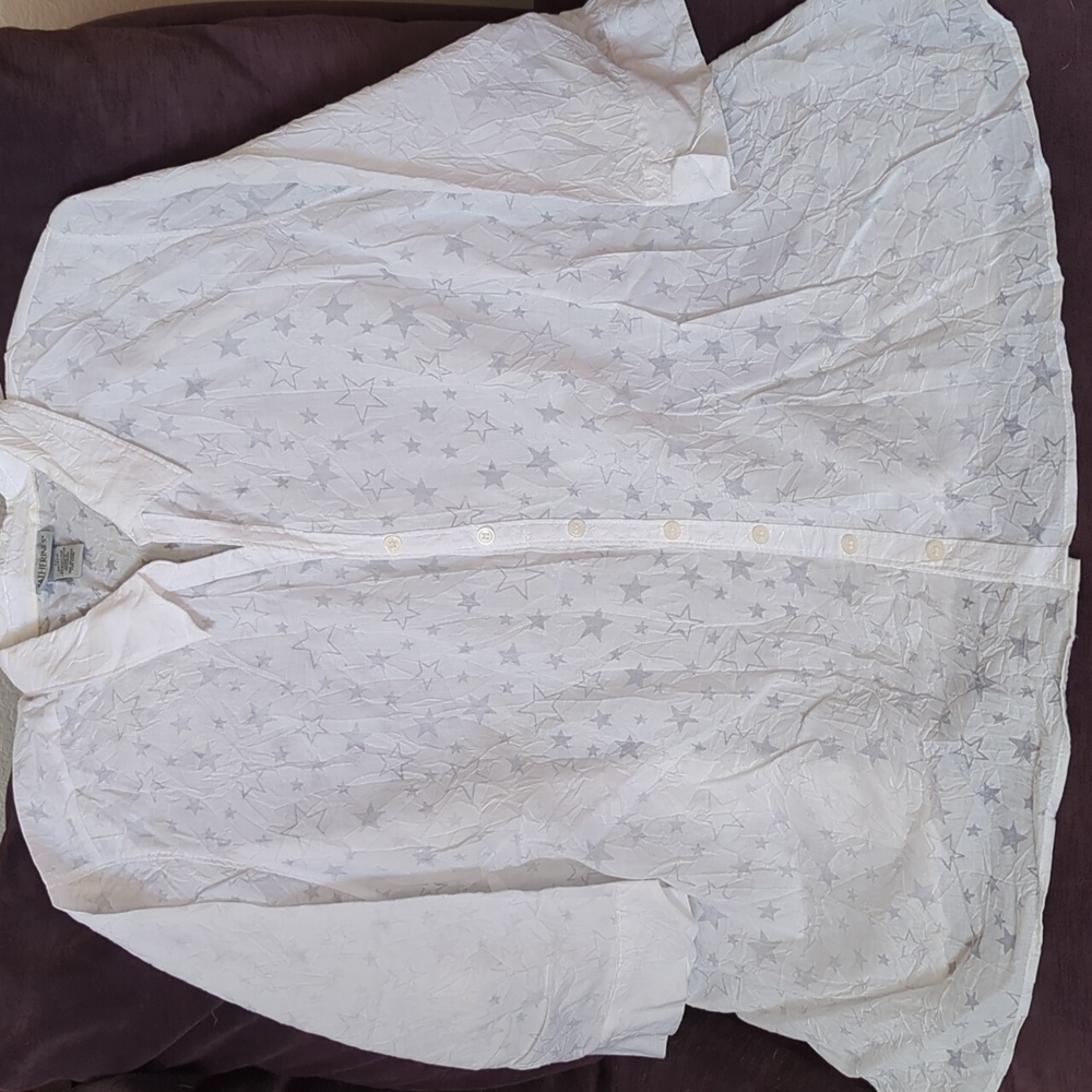 A one of a kind blouse with a  clear pattern of stars